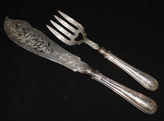 A pair of ornate Victorian engraved silver fish servers by John Gamage, Birmingham, 1869.